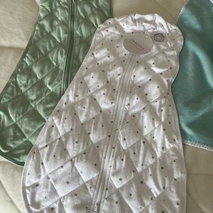 2 dreamland baby swaddles - never used. 1 tags, one without.